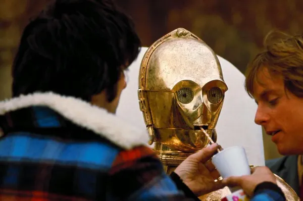 C-3PO drinks through a straw on set for 'Star Wars,' 1976.